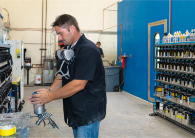 Gary mixing paint for a detail paint project