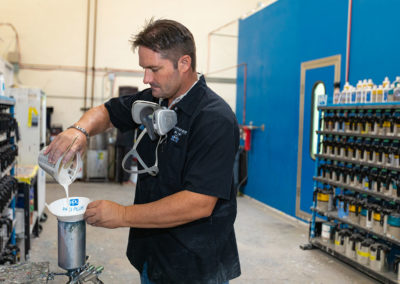 Gary mixing paint for a detail paint project