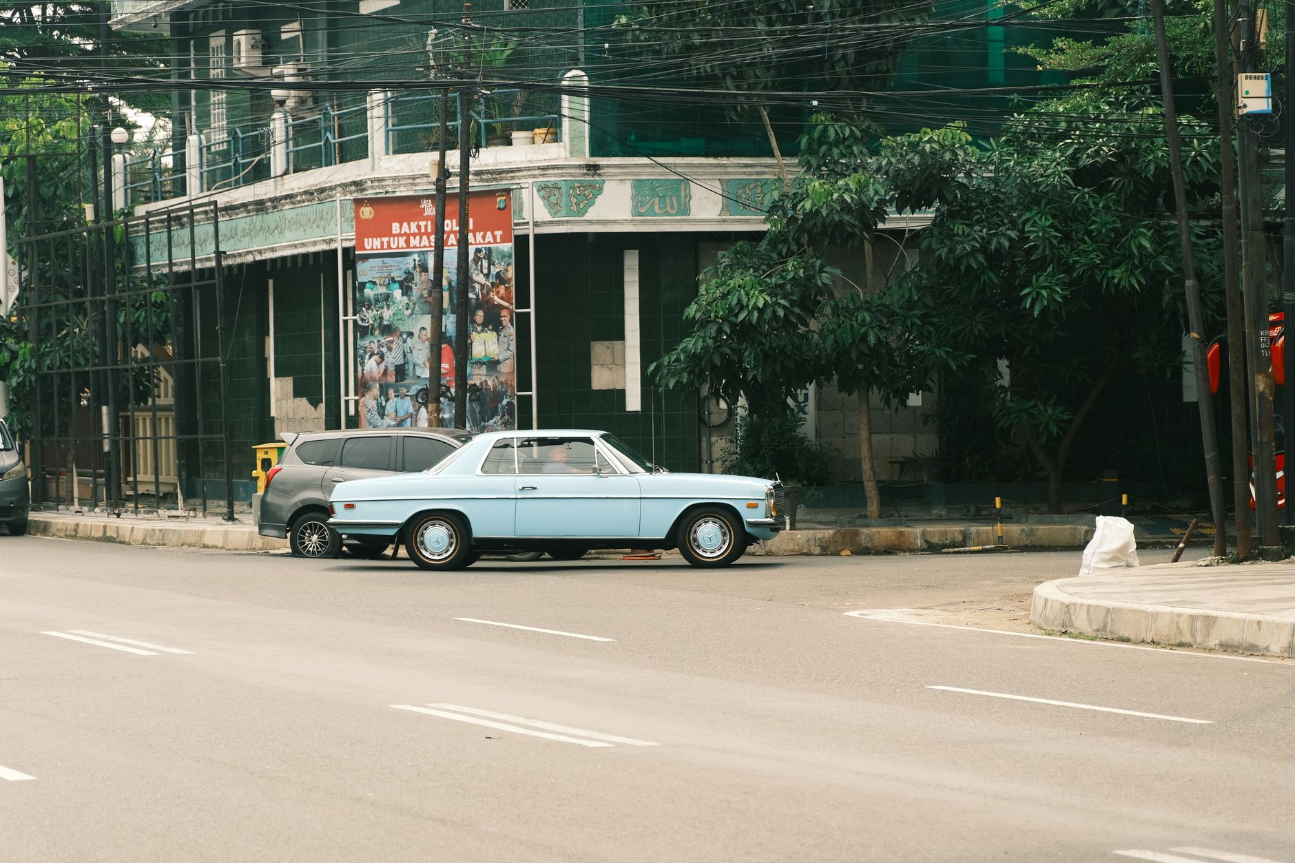 A side-by-side comparison image showing a classic 1960s muscle car, with the left half in pristine restored condition with